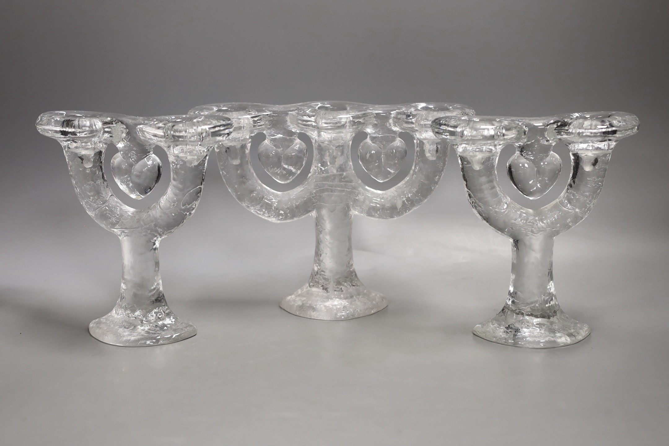 Three graduated Costa glass candelabra - 17cm tall